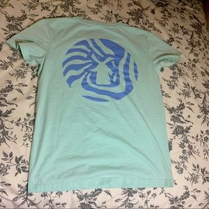 Light blue Dutch Bros t-shirt fun pattern on back